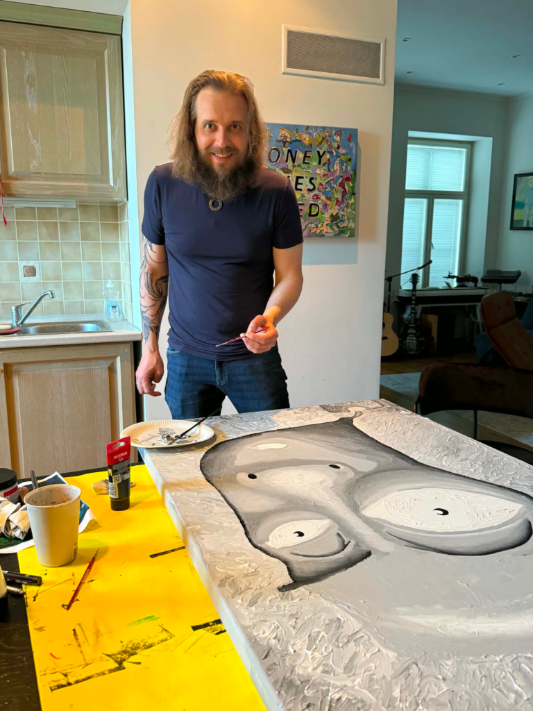 Bent Rushmore painting in his studio